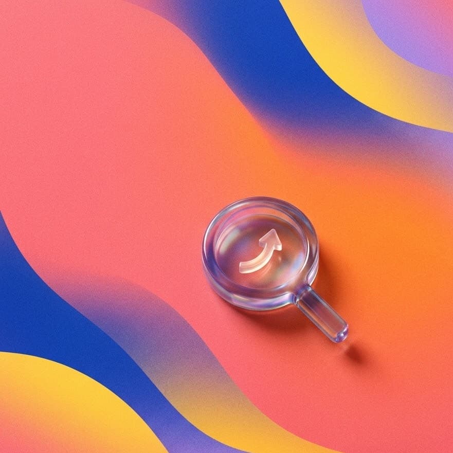 A glass magnifier with an upward arrow inside